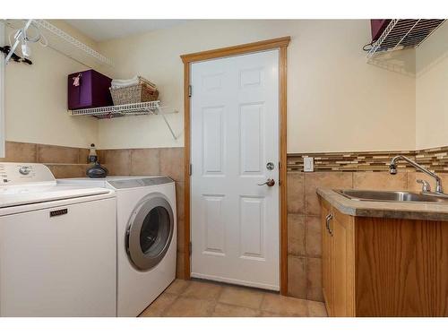 77 Rockbluff Place Nw, Calgary, AB - Indoor Photo Showing Laundry Room