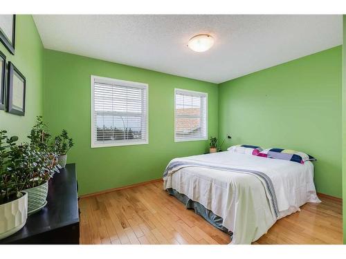 77 Rockbluff Place Nw, Calgary, AB - Indoor Photo Showing Bedroom