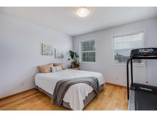 77 Rockbluff Place Nw, Calgary, AB - Indoor Photo Showing Bedroom