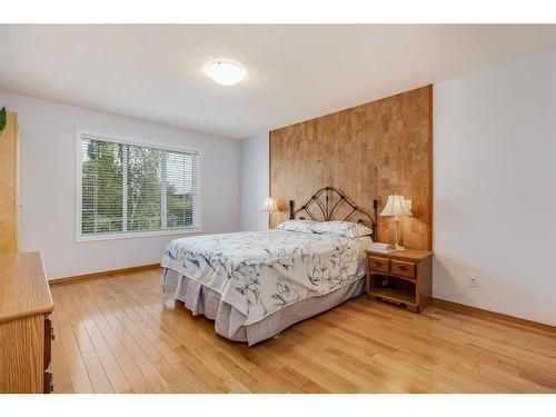 77 Rockbluff Place Nw, Calgary, AB - Indoor Photo Showing Bedroom