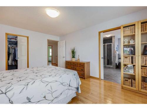 77 Rockbluff Place Nw, Calgary, AB - Indoor Photo Showing Bedroom