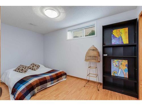 77 Rockbluff Place Nw, Calgary, AB - Indoor Photo Showing Bedroom