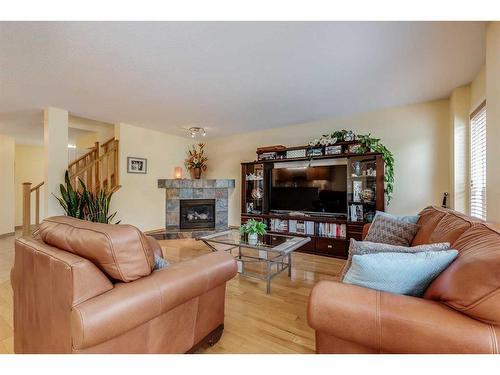 77 Rockbluff Place Nw, Calgary, AB - Indoor Photo Showing Living Room With Fireplace