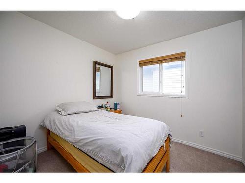 424 New Brighton Drive Se, Calgary, AB - Indoor Photo Showing Bedroom