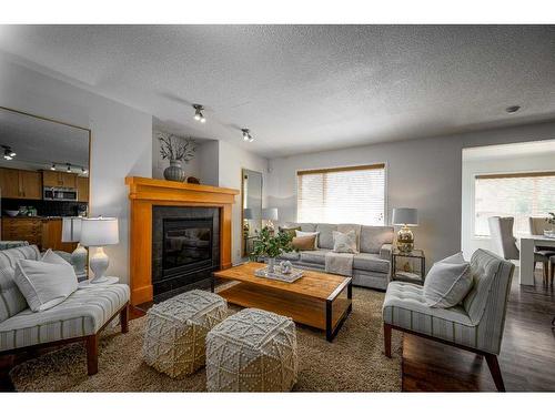 424 New Brighton Drive Se, Calgary, AB - Indoor Photo Showing Living Room With Fireplace