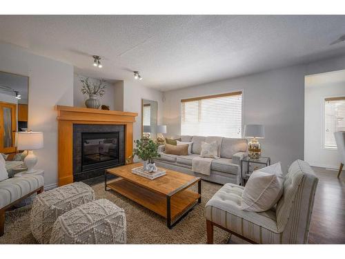 424 New Brighton Drive Se, Calgary, AB - Indoor Photo Showing Living Room With Fireplace