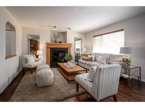 424 New Brighton Drive Se, Calgary, AB - Indoor Photo Showing Living Room With Fireplace