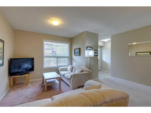 42 Eversyde Common Sw, Calgary, AB - Indoor Photo Showing Living Room