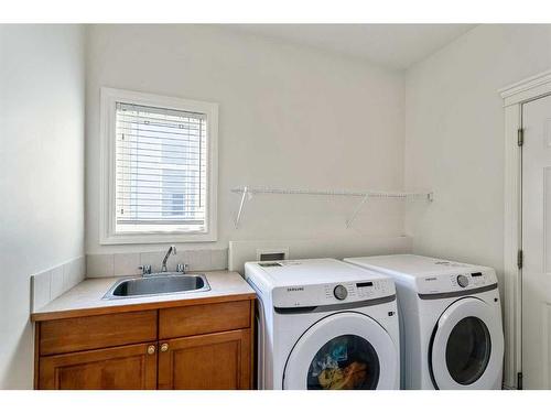 11 Evercreek Bluffs Road Sw, Calgary, AB - Indoor Photo Showing Laundry Room