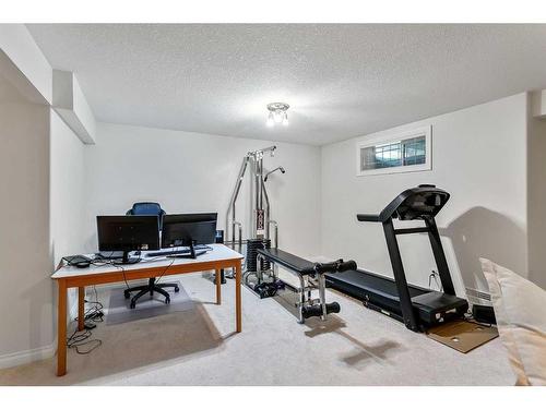 11 Evercreek Bluffs Road Sw, Calgary, AB - Indoor Photo Showing Gym Room