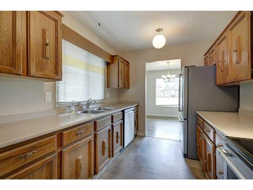 252 Parkside Way Se, Calgary, AB - Indoor Photo Showing Kitchen With Double Sink