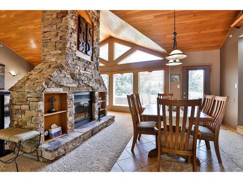 3107 30 Street, Coaldale, AB - Indoor Photo Showing Dining Room With Fireplace