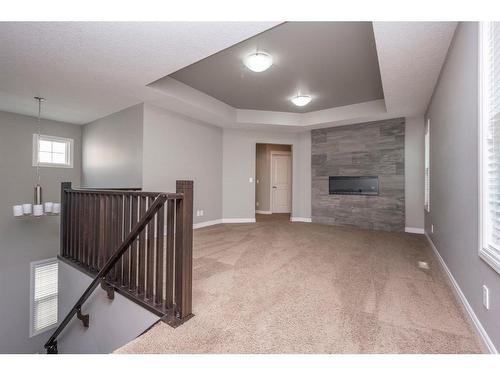 85 Sherwood Heights Nw, Calgary, AB - Indoor Photo Showing Other Room With Fireplace