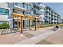 215-4250 Seton Drive, Calgary, AB  - Outdoor With Balcony With Facade 