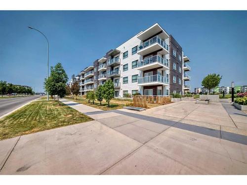 215-4250 Seton Drive, Calgary, AB - Outdoor With Balcony With Facade