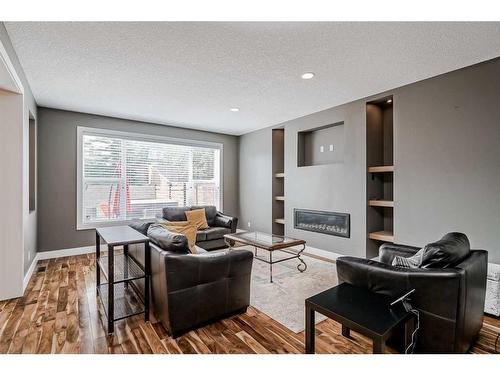 246 Evanspark Circle Nw, Calgary, AB - Indoor Photo Showing Living Room With Fireplace