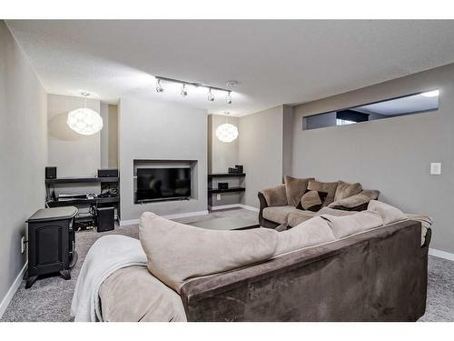 246 Evanspark Circle Nw, Calgary, AB - Indoor Photo Showing Living Room With Fireplace