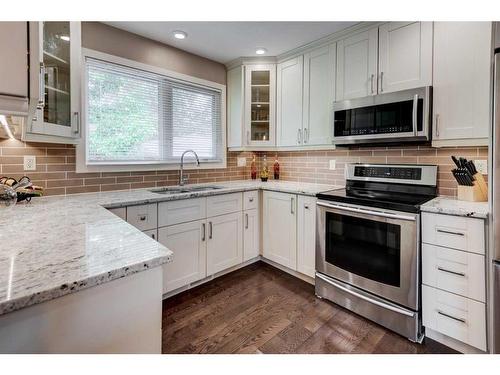 10216 Maplecreek Drive Se, Calgary, AB - Indoor Photo Showing Kitchen With Stainless Steel Kitchen With Double Sink