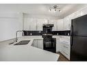 1109-60 Panatella Street Nw, Calgary, AB  - Indoor Photo Showing Kitchen With Double Sink 