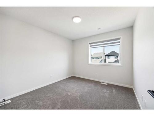 18 Magnolia Court Se, Calgary, AB - Indoor Photo Showing Other Room