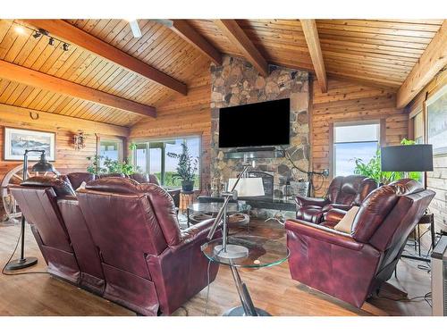 260011 Mountain Ridge Place, Rural Rocky View County, AB - Indoor Photo Showing Living Room With Fireplace