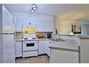 103-3000 Citadel Meadow Point Nw, Calgary, AB  - Indoor Photo Showing Kitchen With Double Sink 