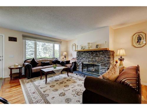 940 Rundlecairn Way Ne, Calgary, AB - Indoor Photo Showing Living Room With Fireplace