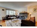 940 Rundlecairn Way Ne, Calgary, AB  - Indoor Photo Showing Living Room With Fireplace 