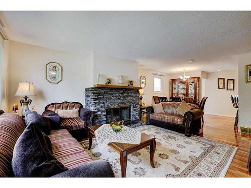 940 Rundlecairn Way Ne, Calgary, AB - Indoor Photo Showing Living Room With Fireplace