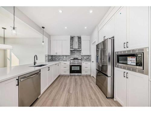 31 Royston Heath Nw, Calgary, AB - Indoor Photo Showing Kitchen With Stainless Steel Kitchen With Upgraded Kitchen