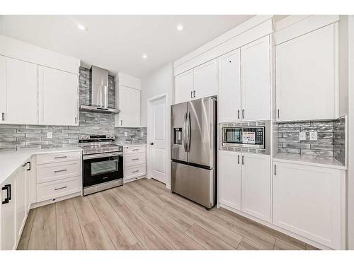 31 Royston Heath Nw, Calgary, AB - Indoor Photo Showing Kitchen With Stainless Steel Kitchen With Upgraded Kitchen