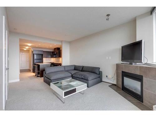 1203-77 Spruce, Calgary, AB - Indoor Photo Showing Living Room With Fireplace