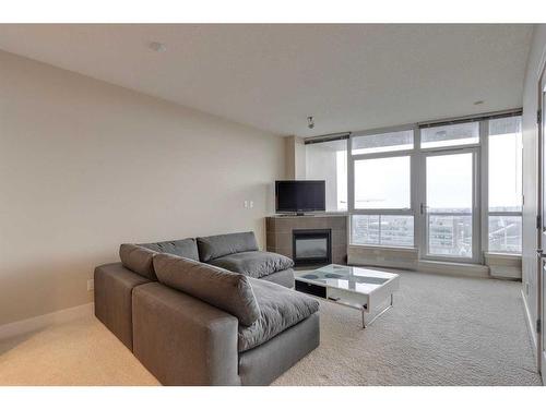 1203-77 Spruce, Calgary, AB - Indoor Photo Showing Living Room With Fireplace