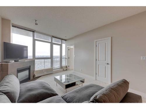 1203-77 Spruce, Calgary, AB - Indoor Photo Showing Living Room With Fireplace