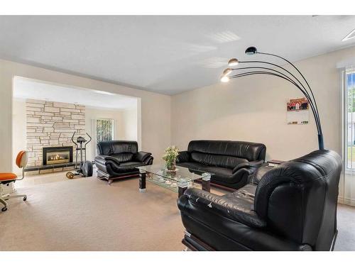 54 Marbrooke Circle Ne, Calgary, AB - Indoor Photo Showing Living Room With Fireplace