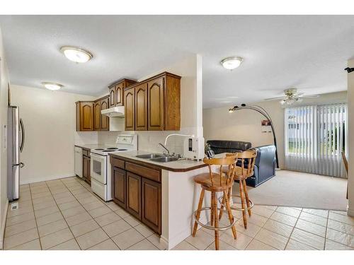 54 Marbrooke Circle Ne, Calgary, AB - Indoor Photo Showing Kitchen With Double Sink