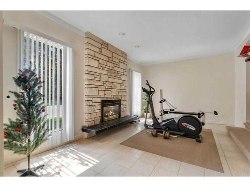 54 Marbrooke Circle Ne, Calgary, AB - Indoor With Fireplace