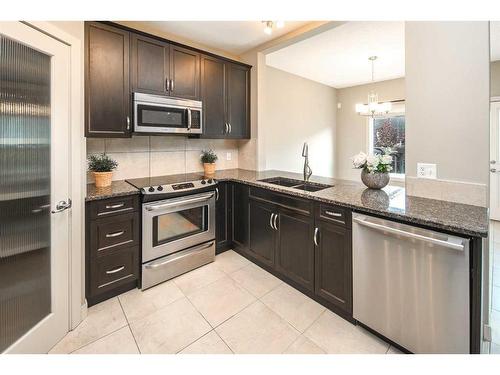 199 Everhollow Street Sw, Calgary, AB - Indoor Photo Showing Kitchen With Stainless Steel Kitchen With Double Sink With Upgraded Kitchen