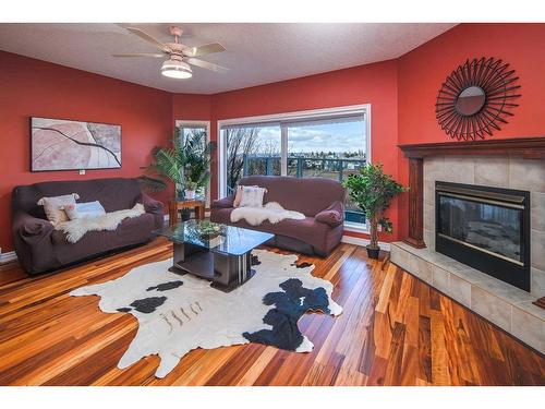 32 Hawkmount Heights Nw, Calgary, AB - Indoor Photo Showing Living Room With Fireplace