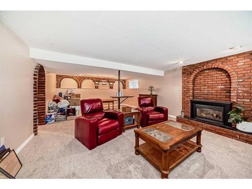 47 Lake Wapta Rise Se, Calgary, AB - Indoor Photo Showing Living Room With Fireplace