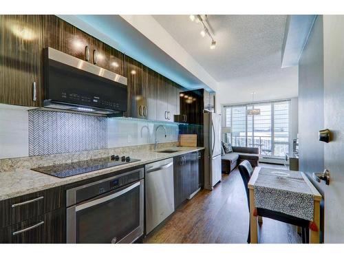 1202-450 8 Avenue Se, Calgary, AB - Indoor Photo Showing Kitchen With Stainless Steel Kitchen