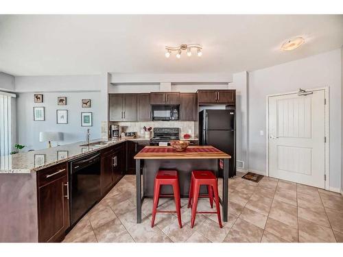 1314-1540 Sherwood Boulevard Nw, Calgary, AB - Indoor Photo Showing Kitchen With Double Sink