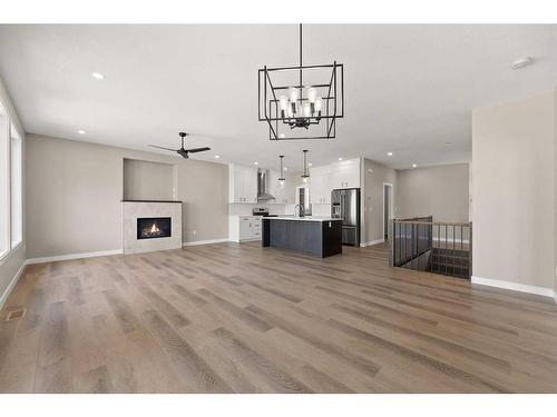 3450 Victory Way, Olds, AB - Indoor Photo Showing Living Room With Fireplace