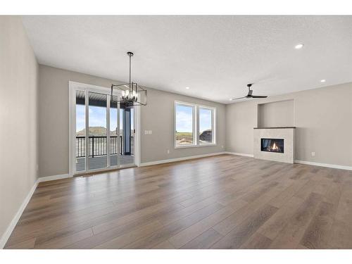 3450 Victory Way, Olds, AB - Indoor Photo Showing Living Room With Fireplace