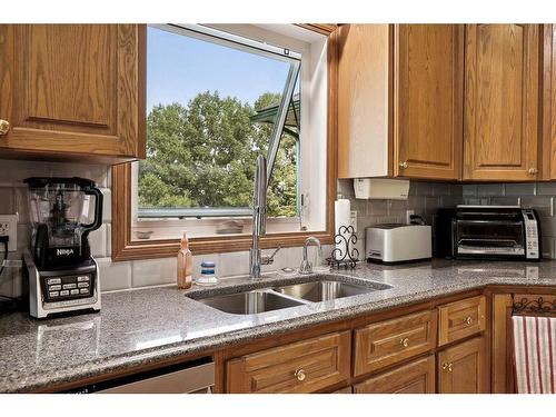 220 Country Lane Drive, Rural Rocky View County, AB - Indoor Photo Showing Kitchen With Double Sink