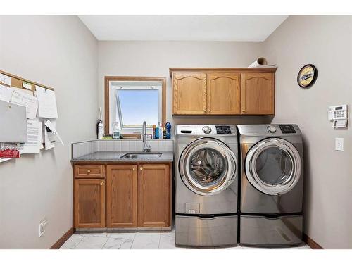 220 Country Lane Drive, Rural Rocky View County, AB - Indoor Photo Showing Laundry Room