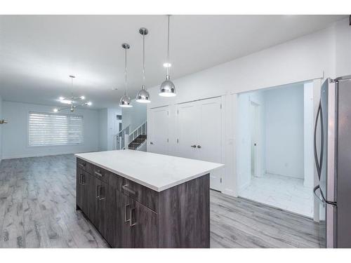 1004 Iron Landing Way, Crossfield, AB - Indoor Photo Showing Kitchen