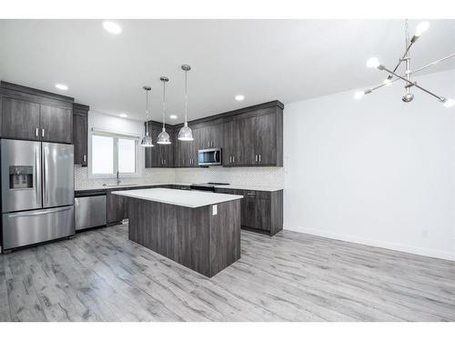 1004 Iron Landing Way, Crossfield, AB - Indoor Photo Showing Kitchen With Upgraded Kitchen