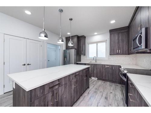 1004 Iron Landing Way, Crossfield, AB - Indoor Photo Showing Kitchen With Upgraded Kitchen