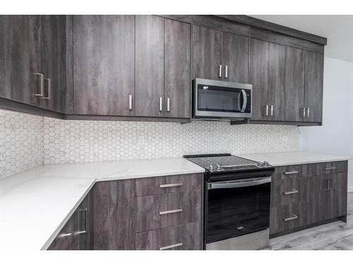 1004 Iron Landing Way, Crossfield, AB - Indoor Photo Showing Kitchen